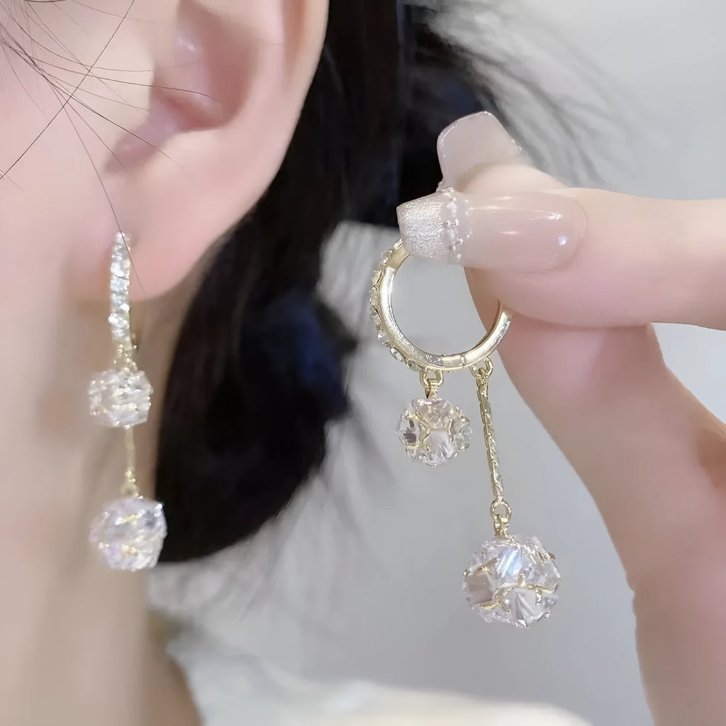 Women's silver drop earrings with tassel ball and rhinestone ball double pendant design, clip-on fastening