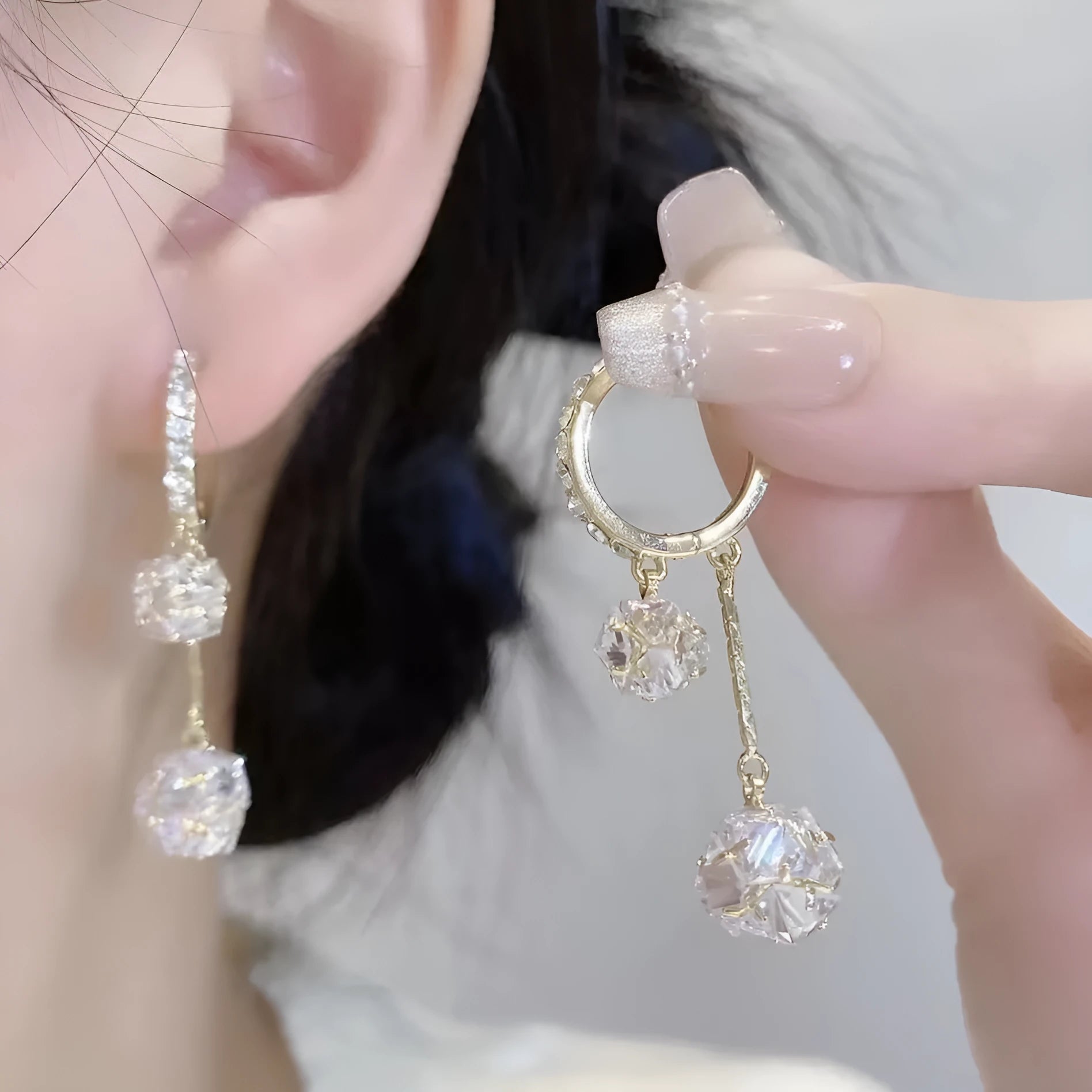 Women's silver drop earrings with tassel ball and rhinestone ball double pendant design, clip-on fastening