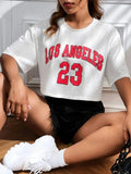 Women's black cotton t-shirt with white English letters printing and navel exposure detail