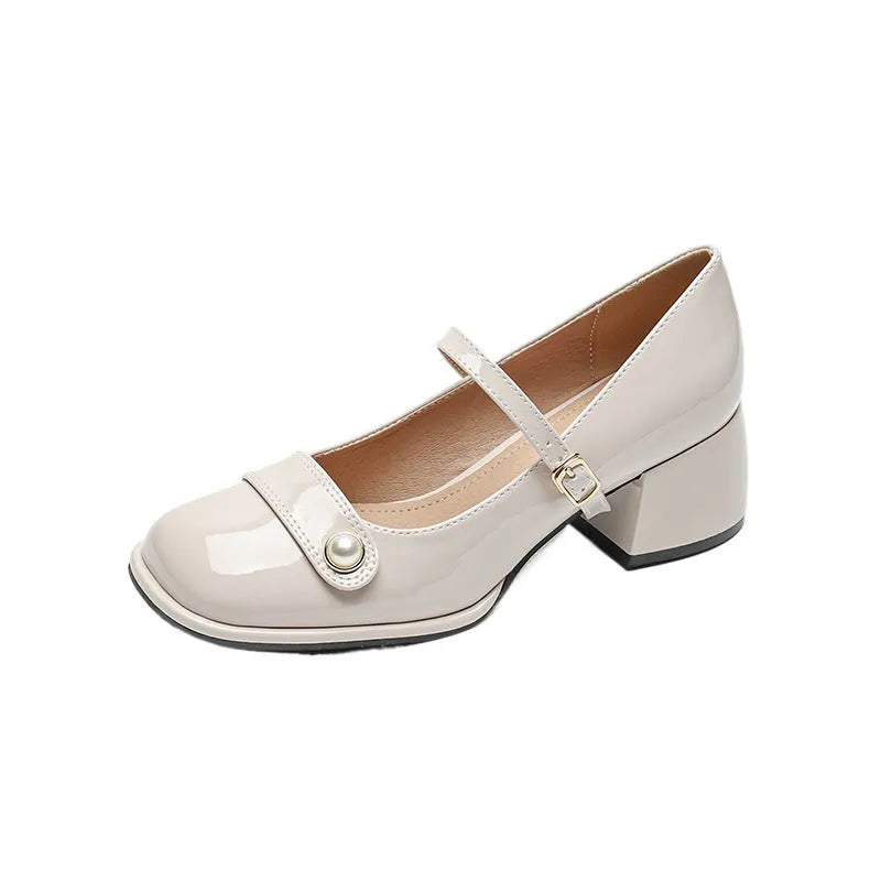 French-style women's chunky heel pumps with patent leather upper and buckle fastening