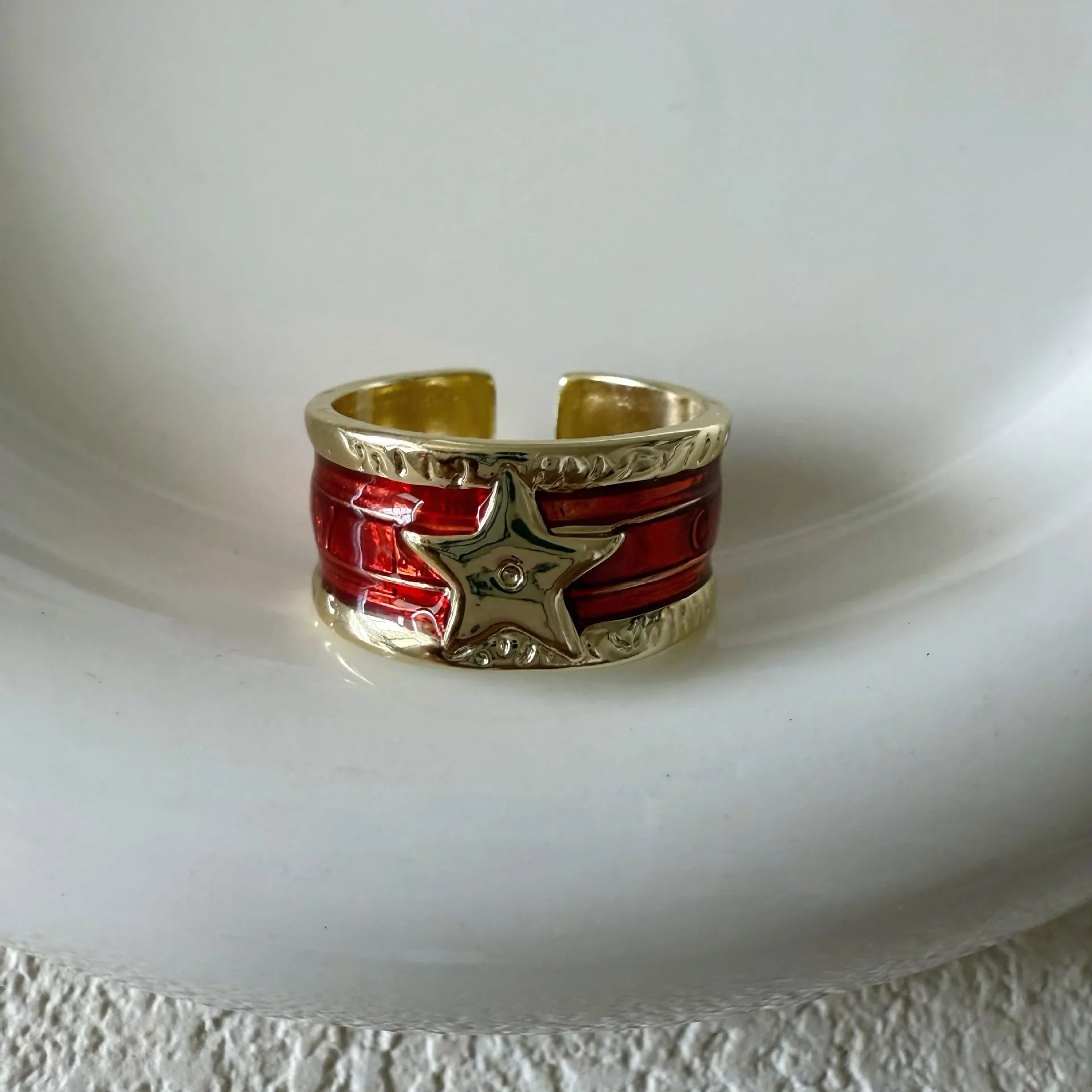 Adjustable geometric drop oil ring for women in copper with distressed finish and lines pattern
