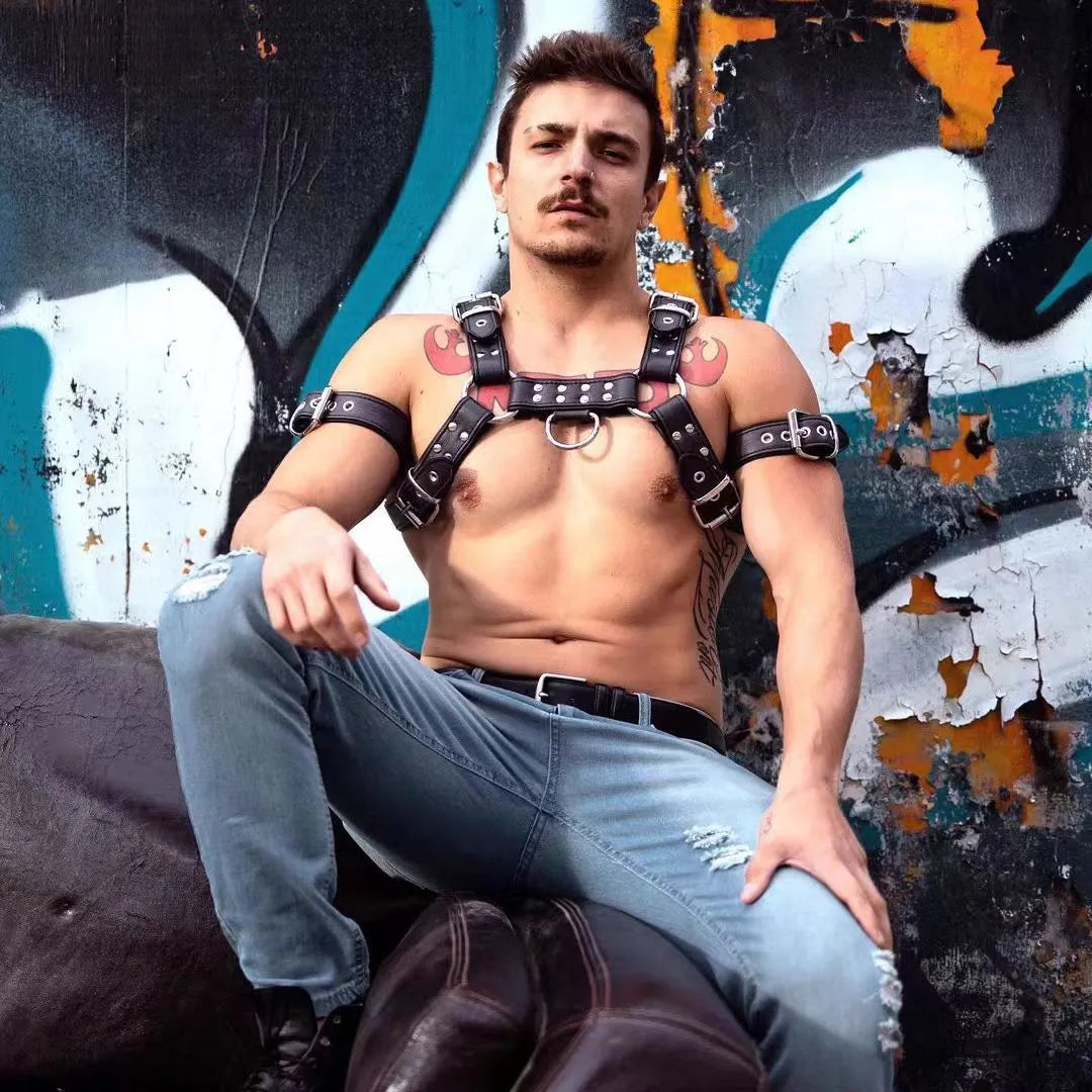 Black leather chest muscle bondage strap with metal buckle adjustment for adult shoulder harness