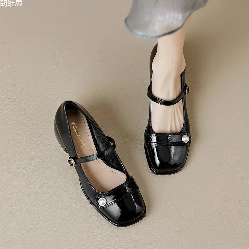 French-style women's chunky heel pumps with patent leather upper and buckle fastening