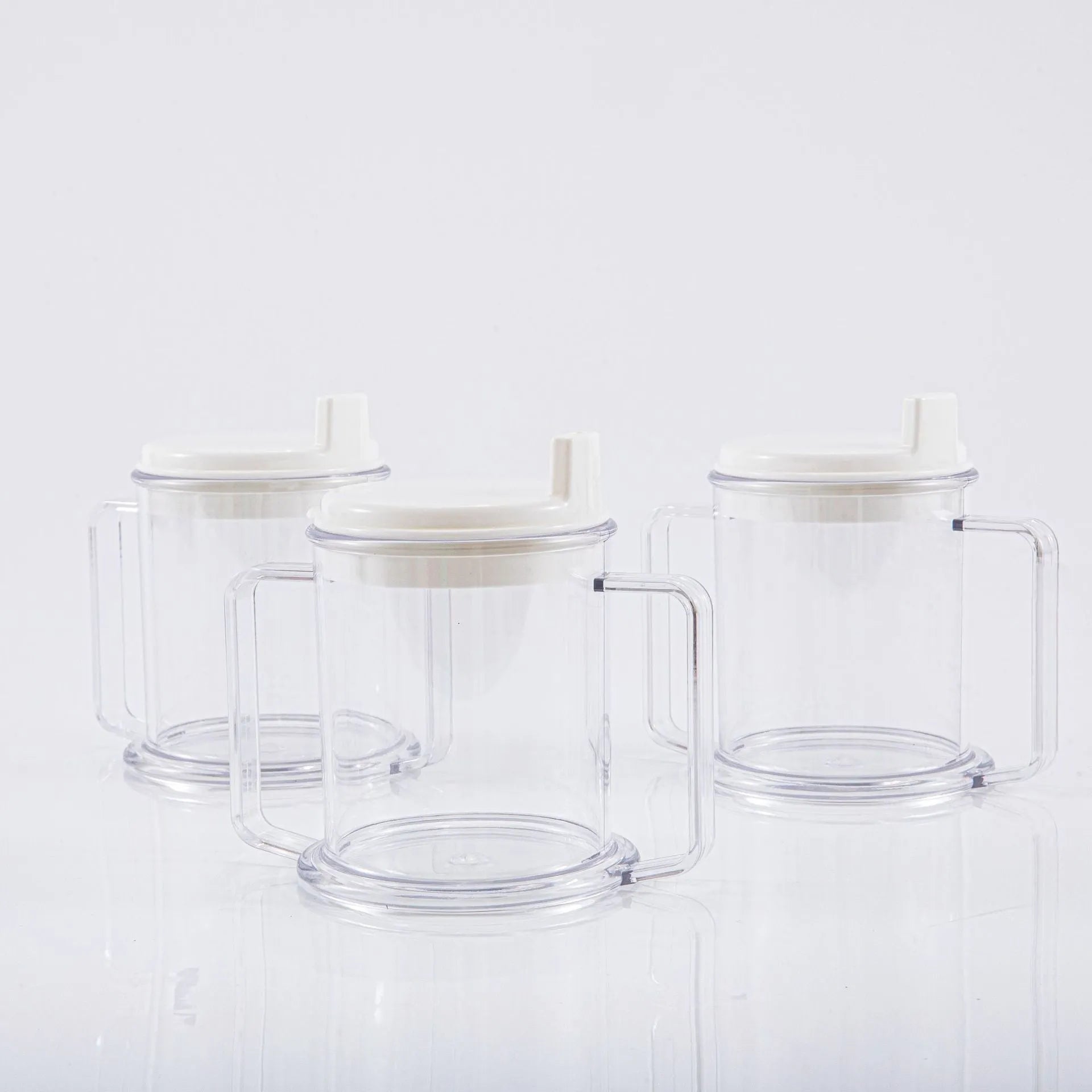 Transparent spill-proof plastic drinking cup showing 14cm height and 12cm diameter