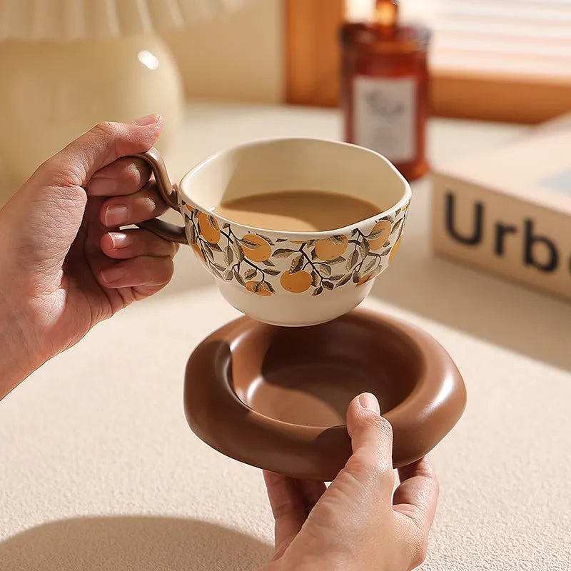 Antique style ceramic coffee cup and saucer set in black or orange medieval design, 210ml capacity.