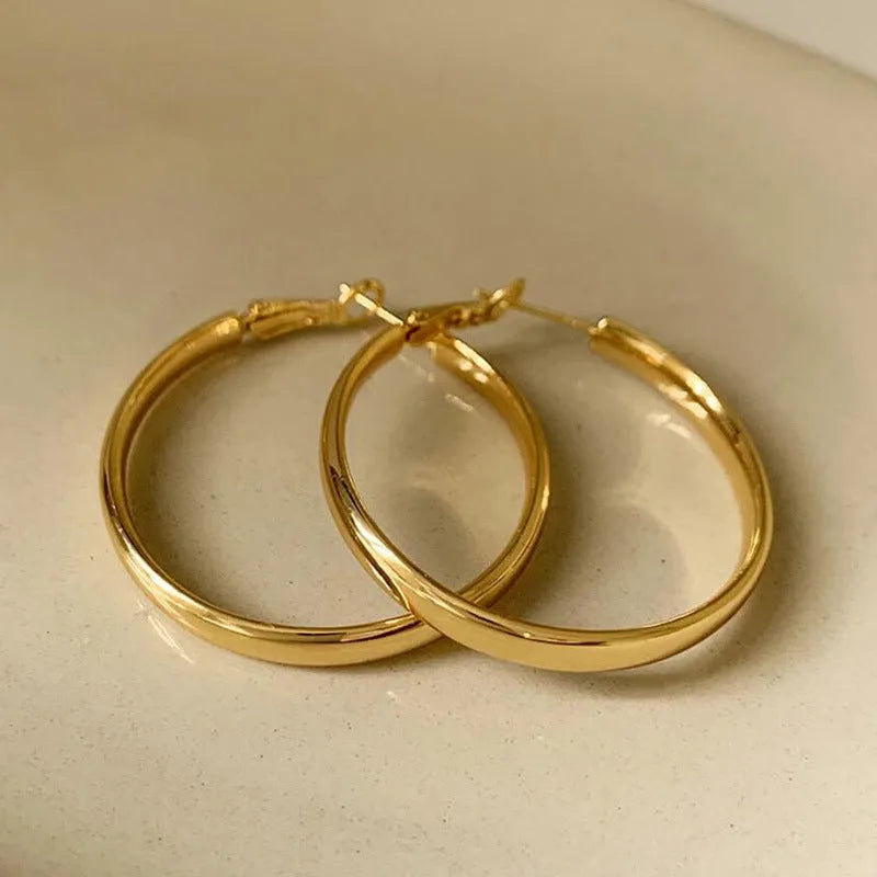 40mm diameter gold and silver metal circle hoop earrings on copper base