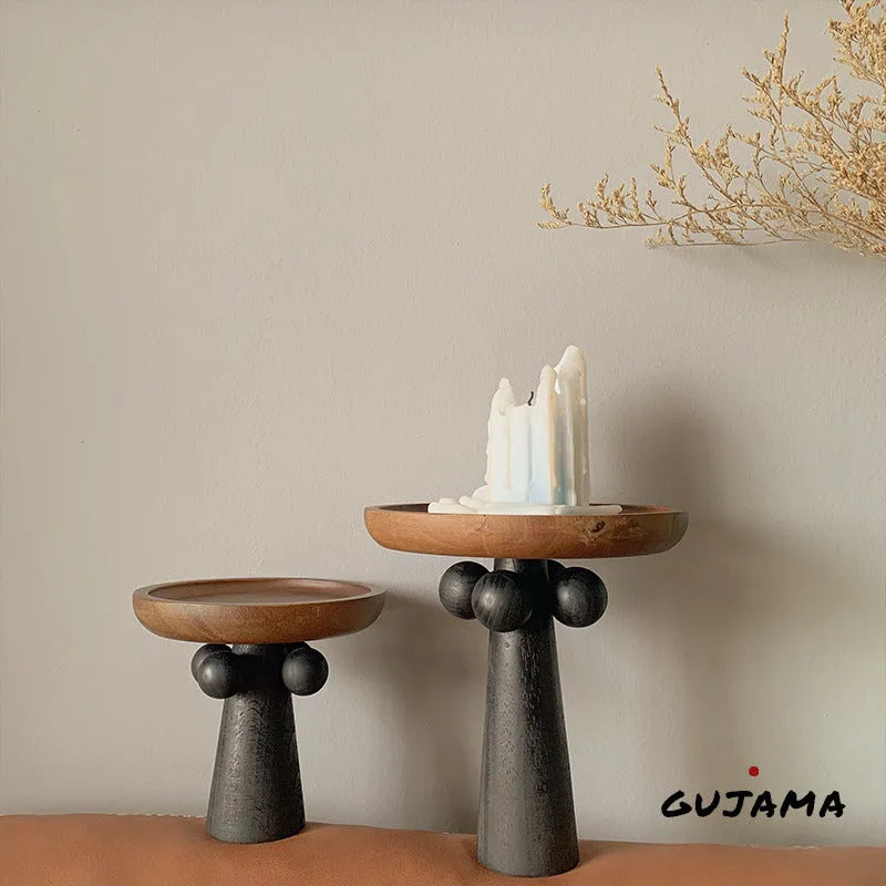 Nordic high-legged wooden round tray displaying candles and perfume bottles