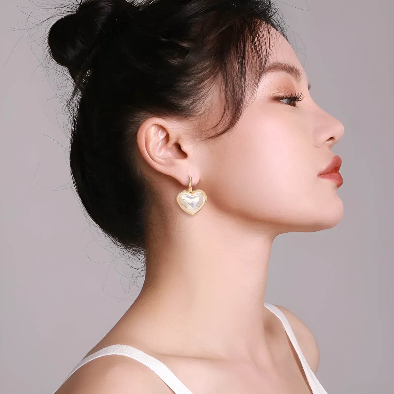 Gold colour clip-on earrings for women with metal alloy construction and natural summer style design