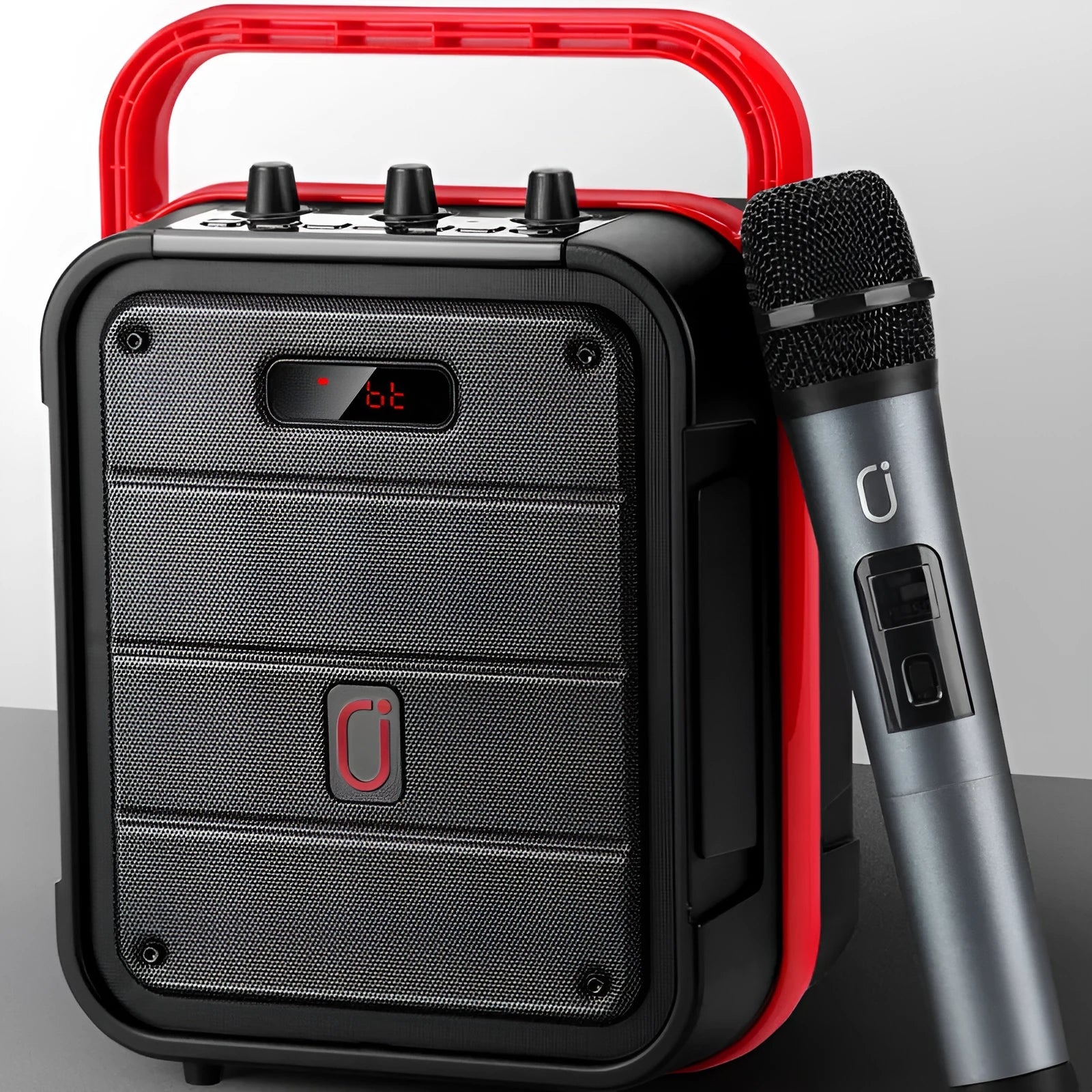 MS62AI portable Bluetooth speaker with wireless microphone and remote control on table