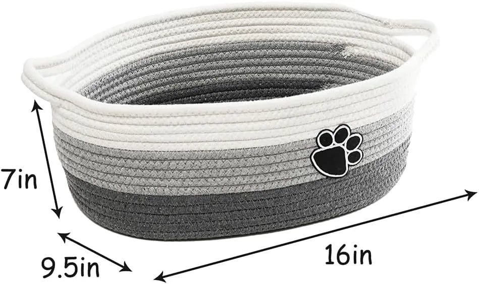 Small light beige handmade cotton rope storage basket with a wooden handle.