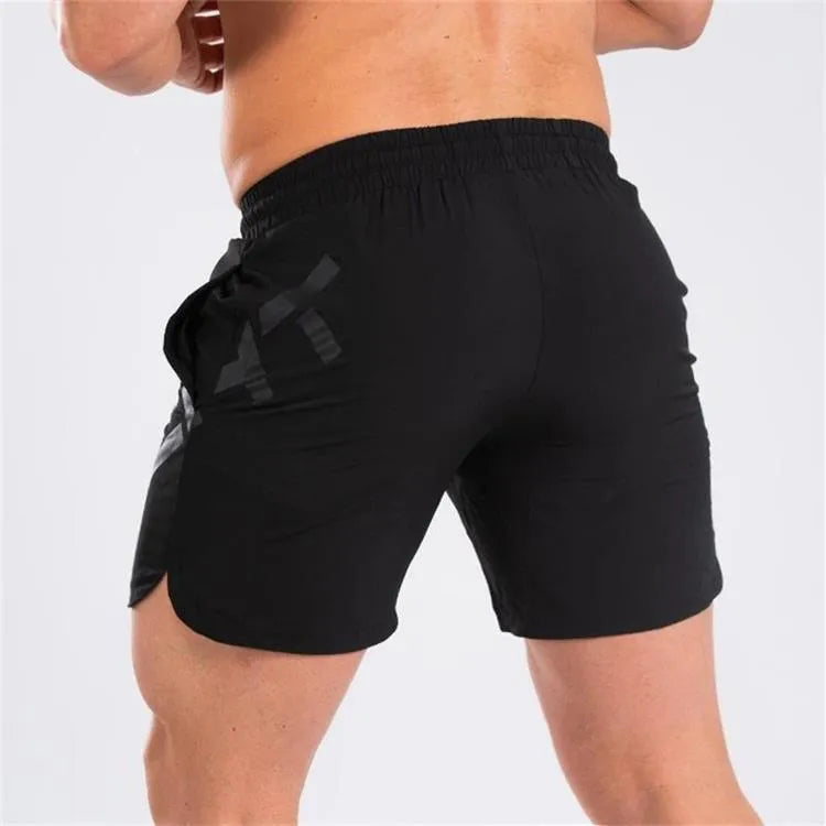 Men's knee-length quick-dry nylon sports shorts in black with elastic mid-waist