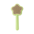 Green and yellow self-cleaning cat comb with stainless steel needles for pet grooming.