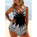 Women's plus size blue gradient print skirted swimsuit with deep V-neck and printed straps.