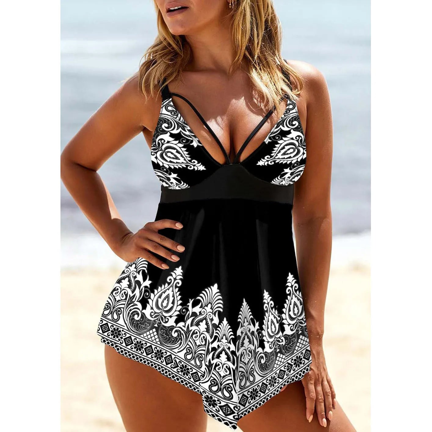 Women's plus size blue gradient print skirted swimsuit with deep V-neck and printed straps.