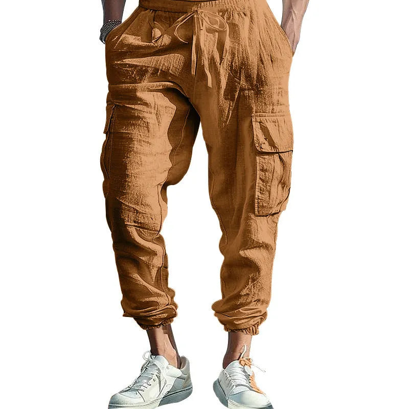 Men's loose-fit linen casual trousers with ankle-tied cuffs and multiple pockets in a solid colour.