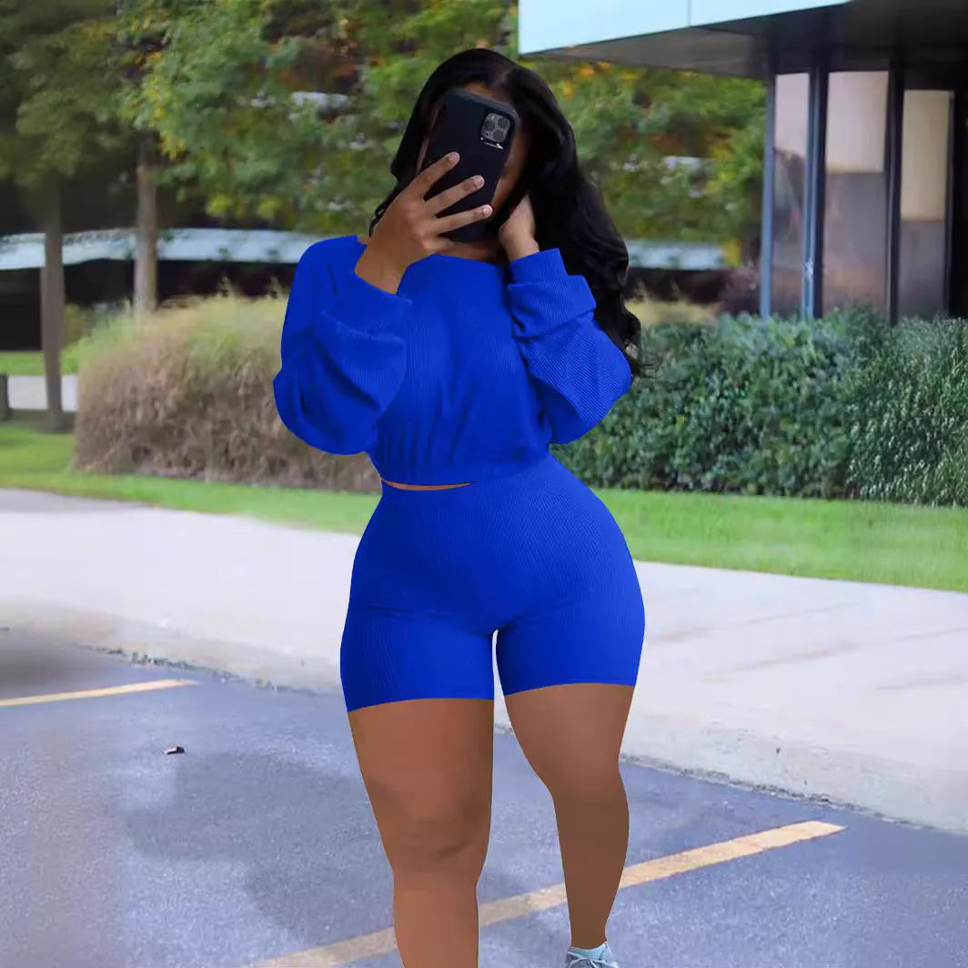 Women's off-the-shoulder long sleeve top and matching shorts two-piece set in a sunken stripe pattern.