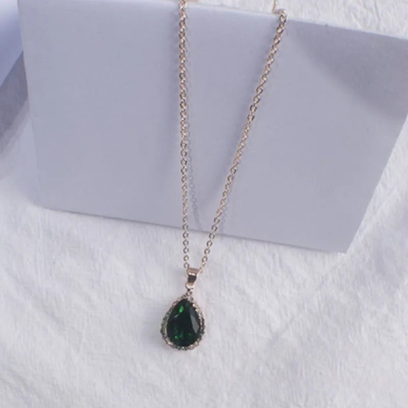 Women's alloy water drop necklace with rose gold electroplated colour and rhinestone inlays on a geometric pendant.