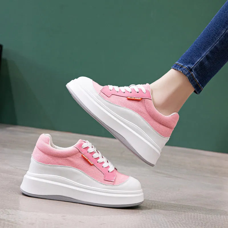 Women's beige and pink leather platform shoes with thick soles, shown from the side.