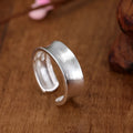 Geometric open ring with frosted sterling silver finish and adjustable opening design
