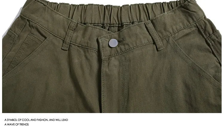 Women's workwear cropped pants with wide-leg cut in apricot colour showing mid-waist and micro-elastic waistband