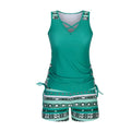Women's blue printed lace two-piece swimsuit with a sleeveless top and brief shorts.