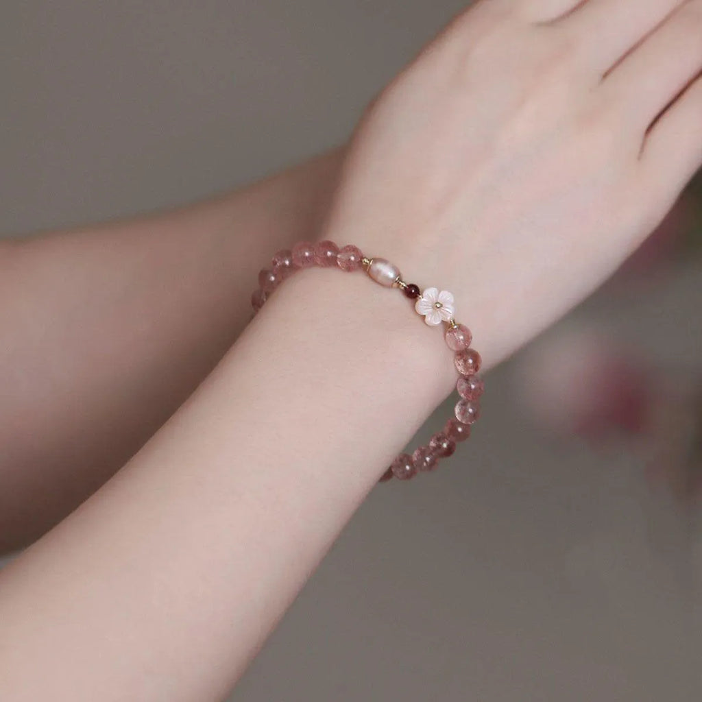 Strawberry quartz crystal flower bracelet with adjustable fastening on wrist