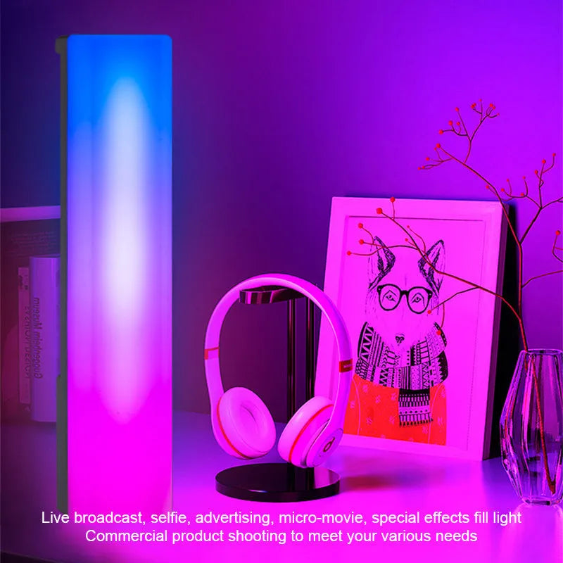 Black and white 3D RGB voice-activated music rhythm ambiance lamp on a table.