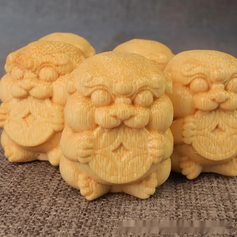Small solid bamboo carving ornament measuring 4.5cm tall on a wooden surface.