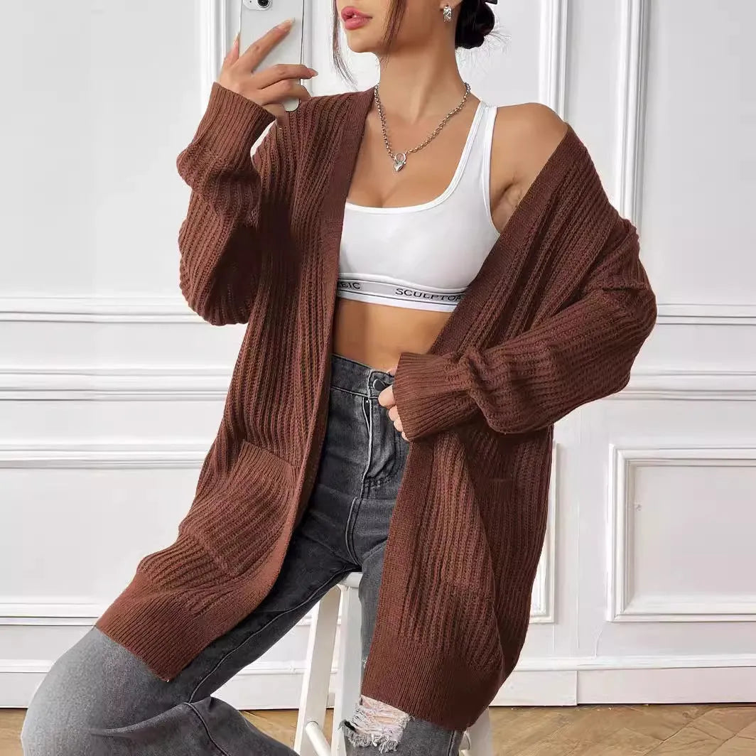 Women's dark green acrylic cardigan sweater with double pockets and long sleeves
