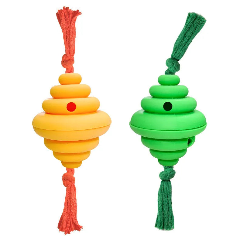 Green and yellow silicone dog ball with attached rope for tug-of-war and treat dispensing.