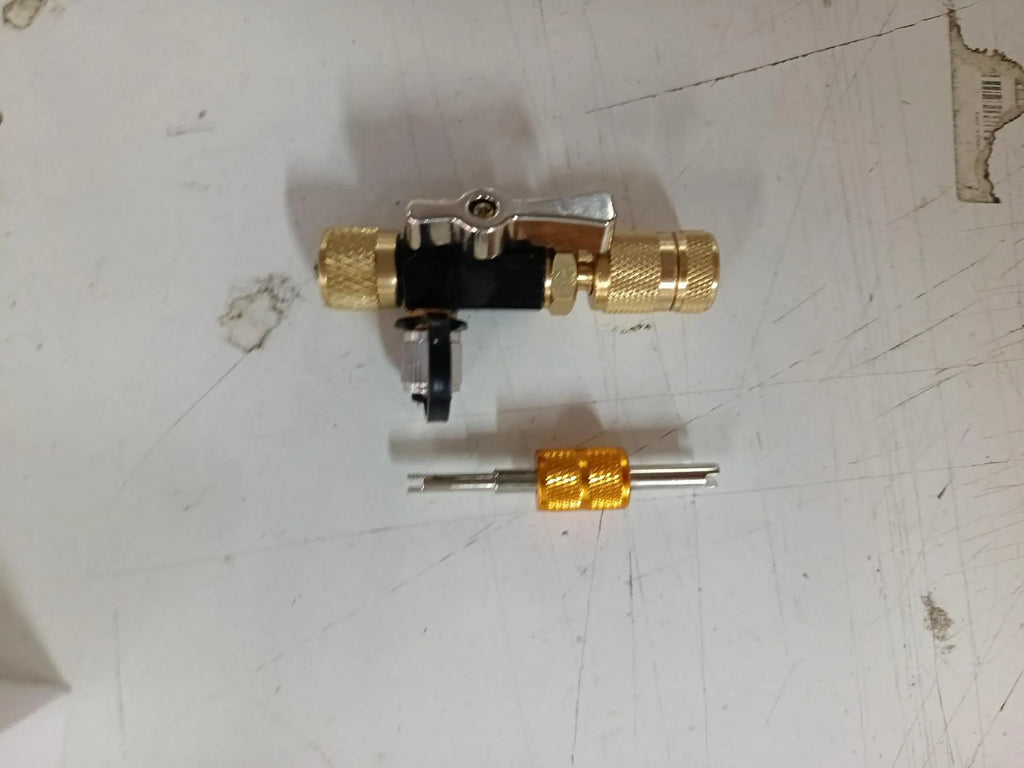 Metal vacuum valve core disassembly tool set showing black and pink valve removers