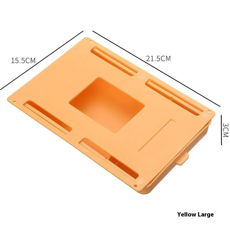 Small grey plastic drawer with a white cover and internal grid, shown mounted under a wooden table.