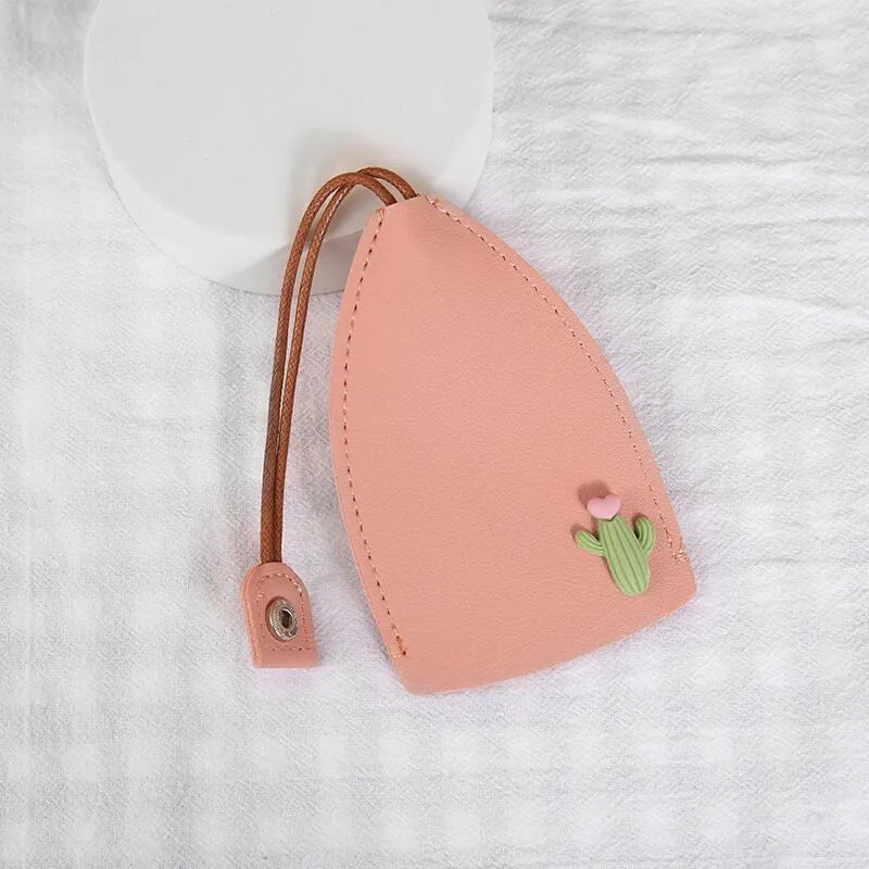 Colourful cartoon pull-out key protector case made from PU leather, showing a selection of fruit and animal designs.