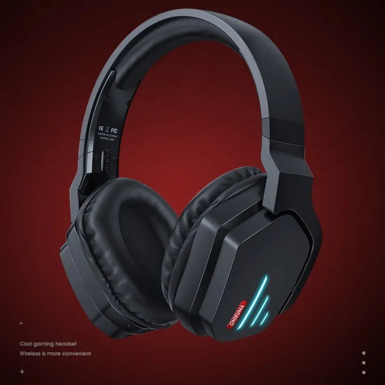 Luminous black wireless over-ear gaming headphones with adjustable headband showing ear cups and included 3.5mm cable
