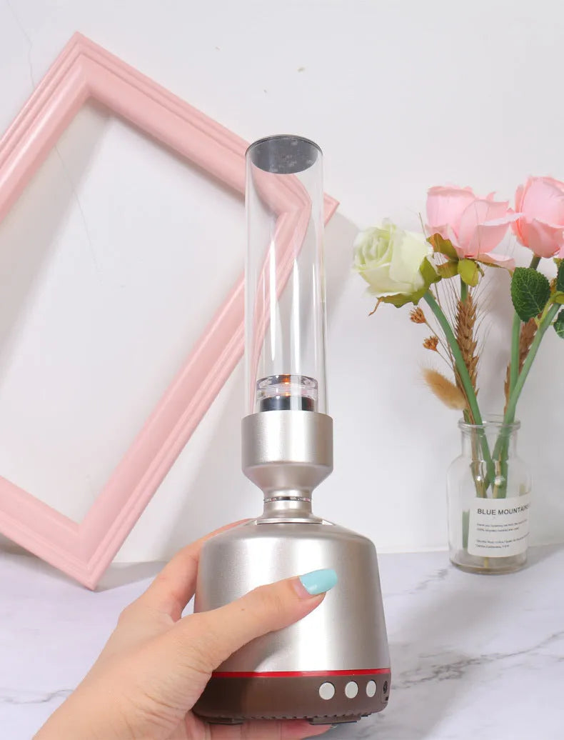 White silver Bluetooth speaker with LED candlelight night light showing modern simple design