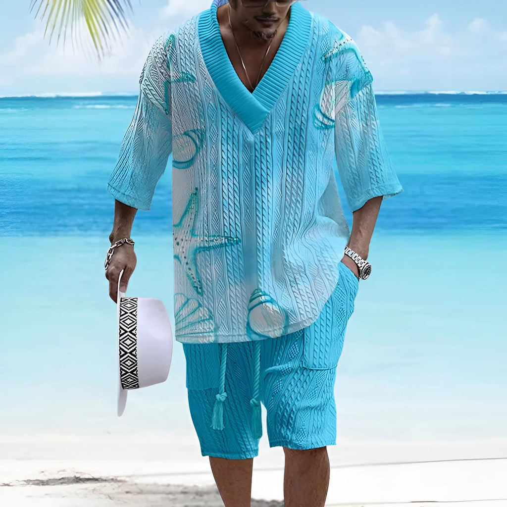 Man wearing a loose-fitting light blue short sleeve suit top and matching shorts on a casual summer day.