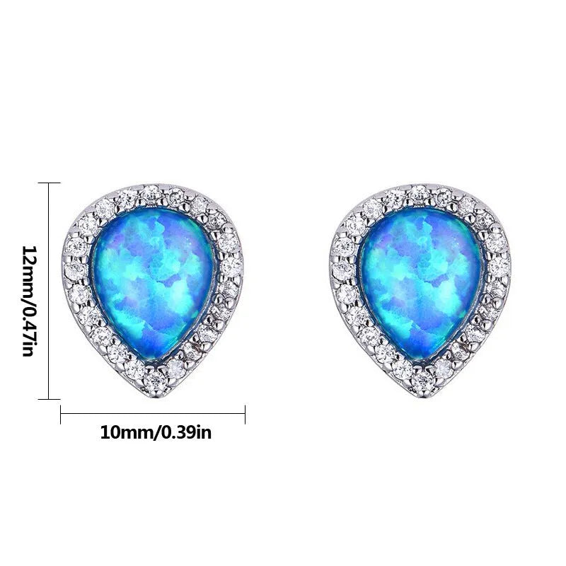 Blue opal drop-shaped stud earrings on copper base with inlaid gem setting