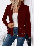 Women's solid colour coat with beaded zipper and ruffled hem detail