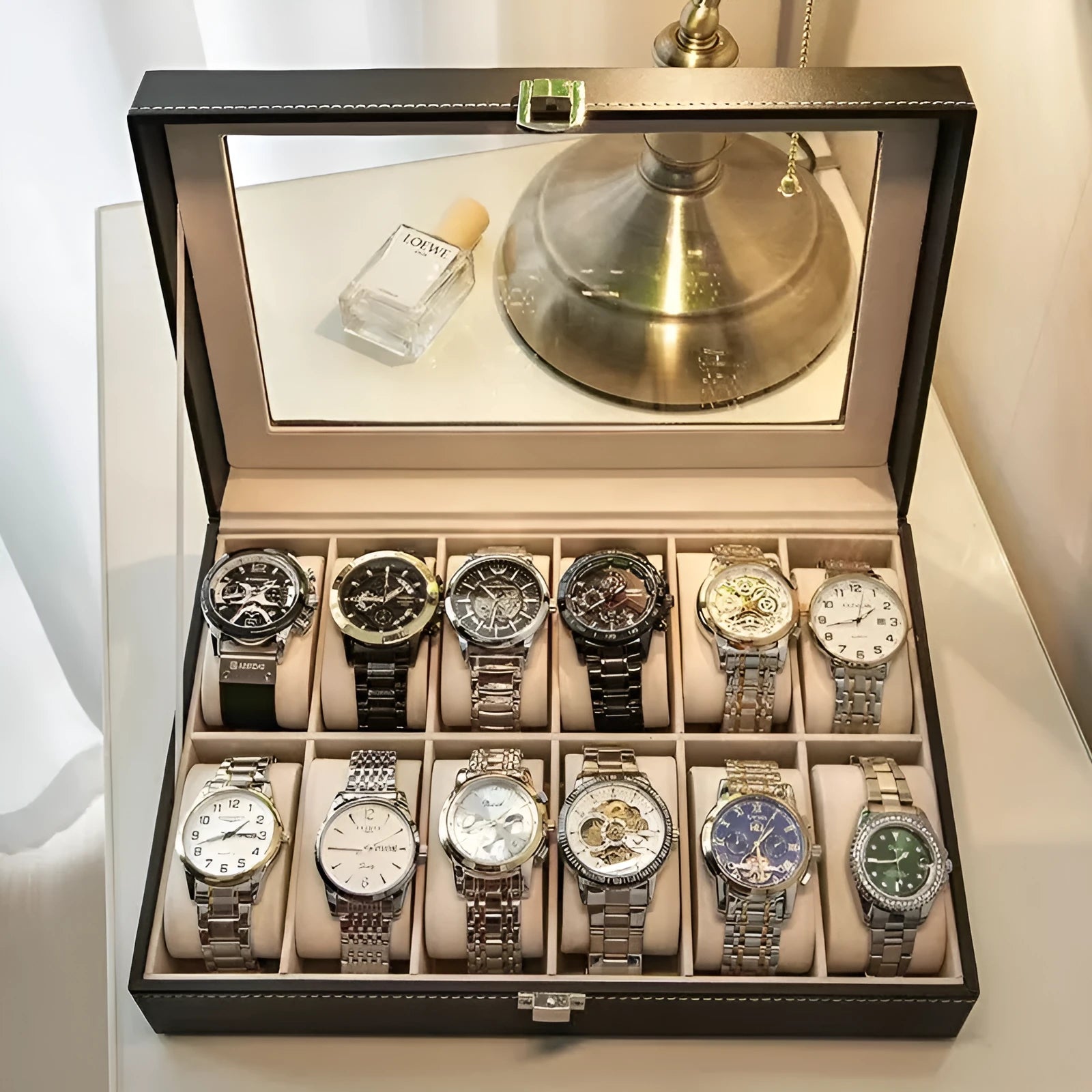 Grey high-grade leather watch storage box with a clear, dustproof lid on a table.