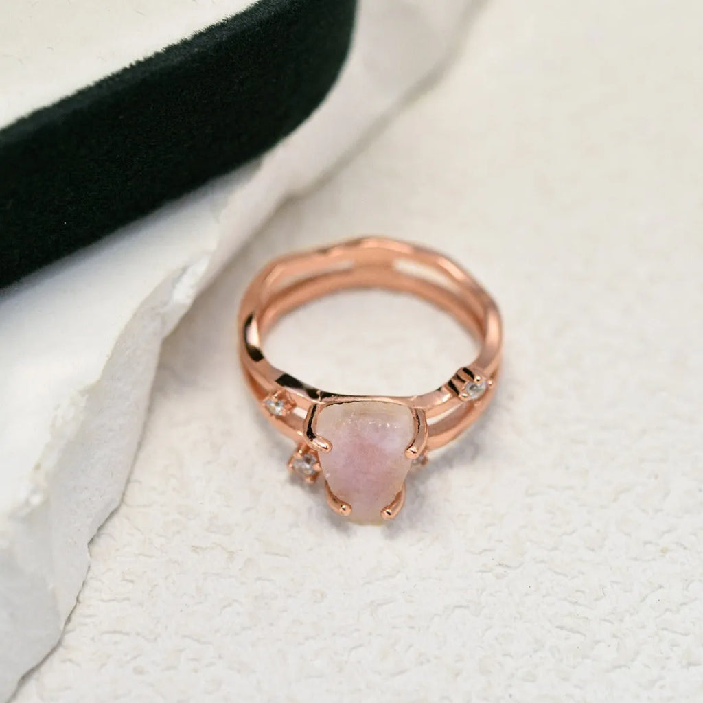S925 silver ring with an irregular triangle shape holding a moonstone, shown in a rose gold electroplated finish.