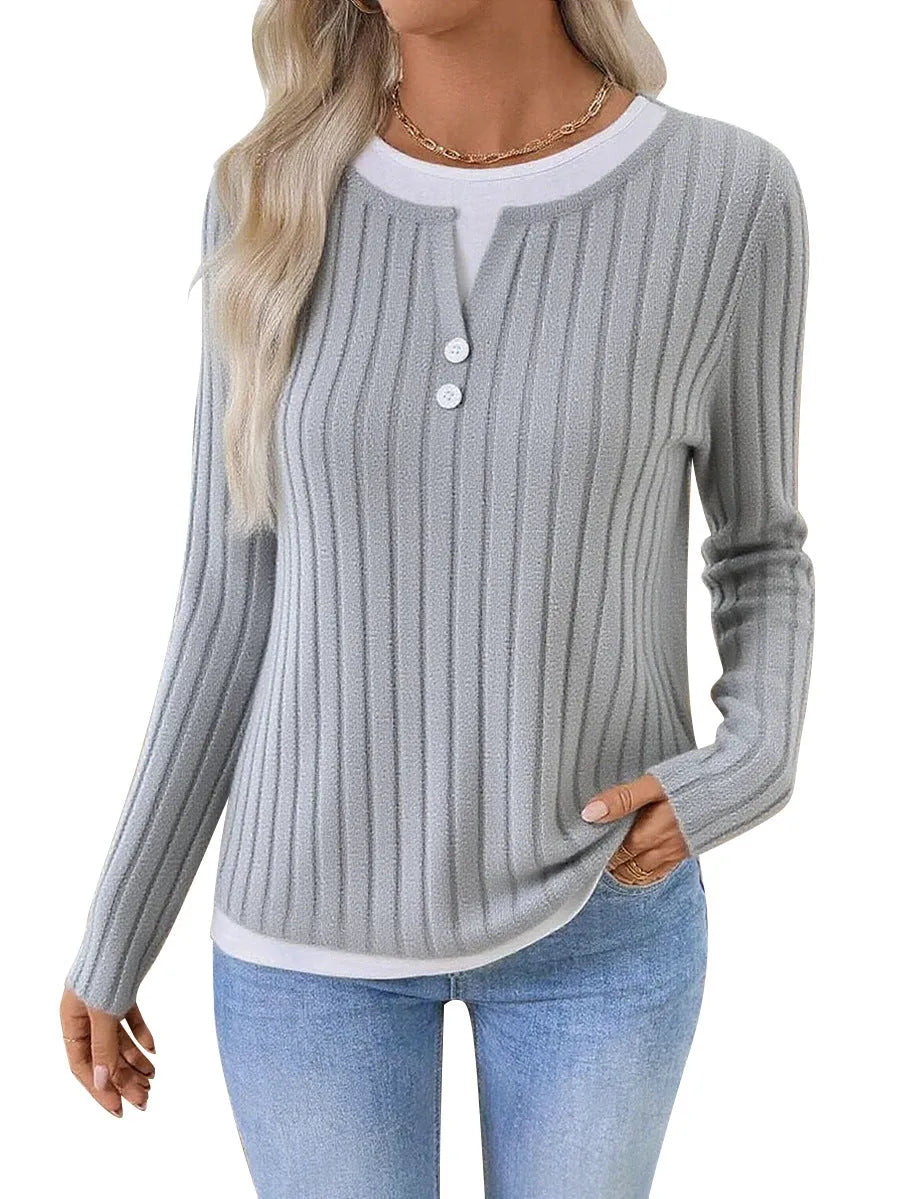 Women's black fake two-piece pullover sweater with round neck and button detail on concave stripe fabric