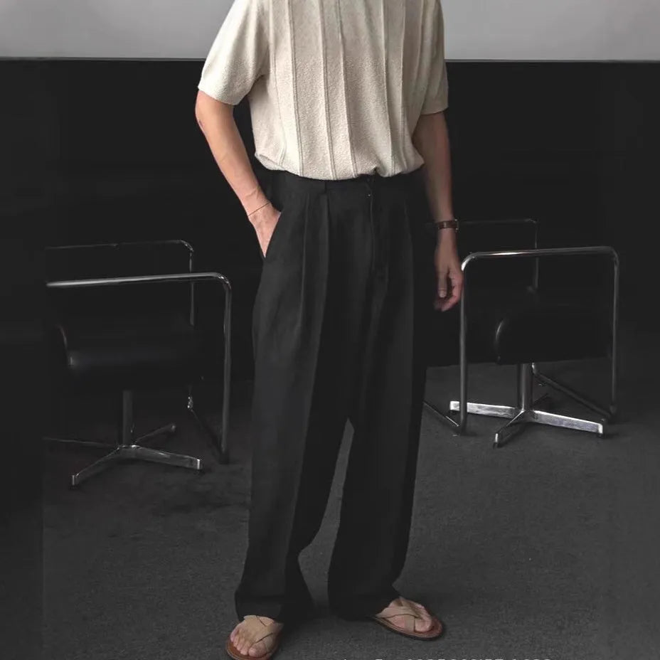 Men's apricot-coloured loose-fit cotton linen trousers with a wide-leg cut and elastic waistband