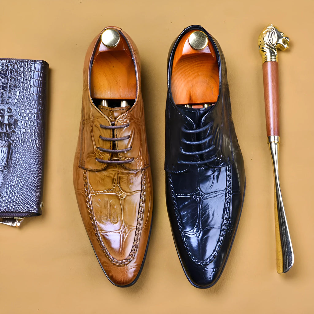 Men's black and brown leather shoes with alligator pattern texture and horse bit buckle detail