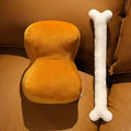 Creative meat bones plush toy in big stick meat bones colour on a sofa