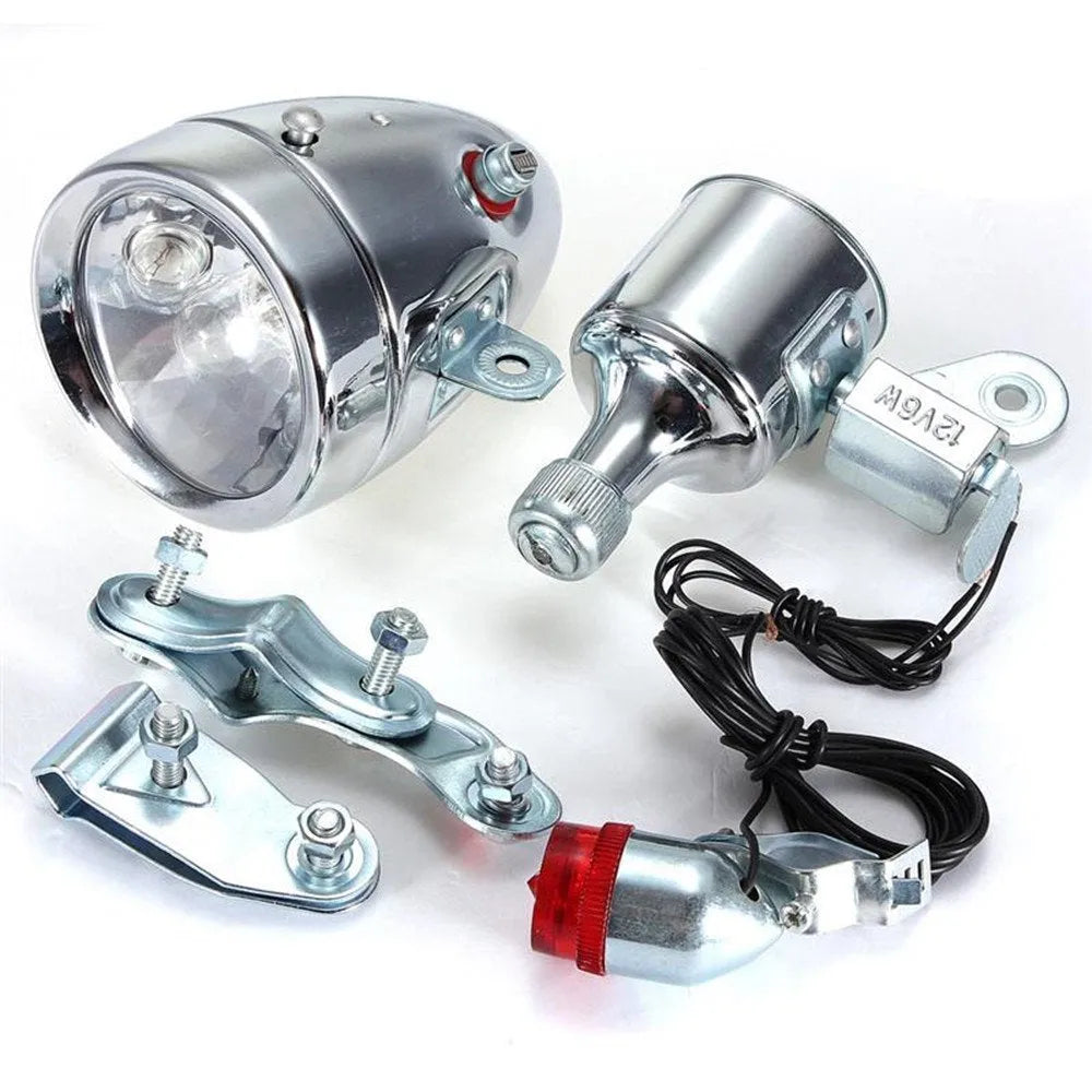 Silver bicycle dynamo light kit for front fork mounting with friction generator