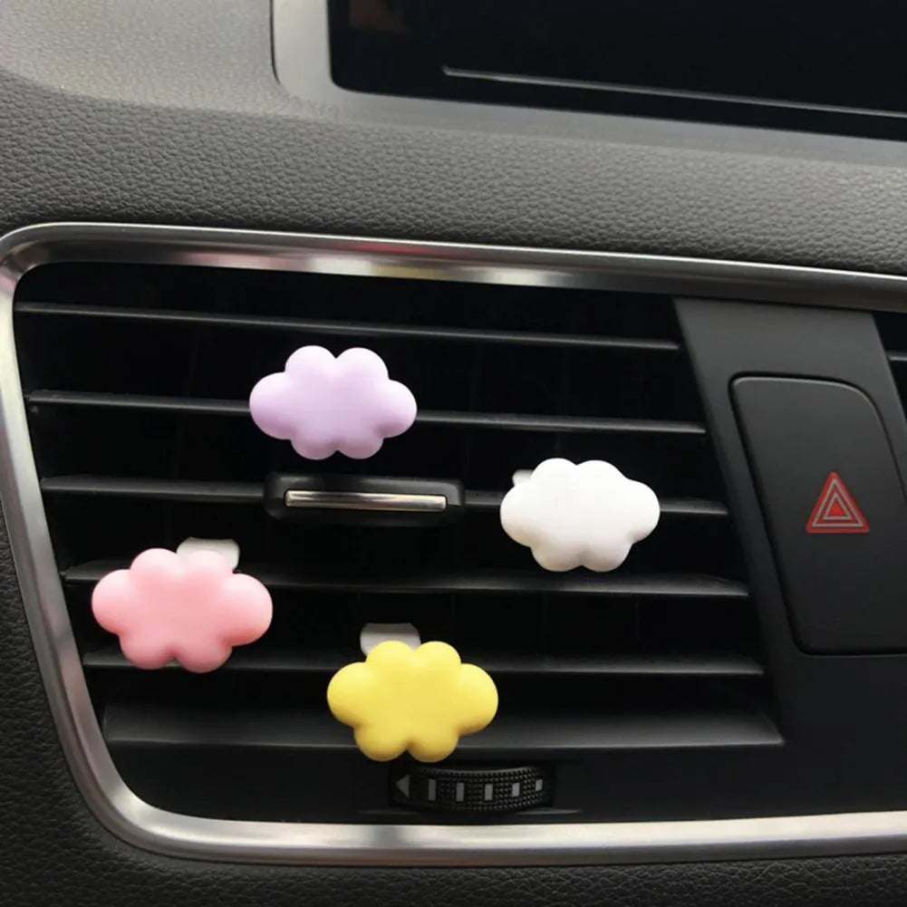 Resin Baiyun cartoon car fragrance clip for air vents in light green colour.
