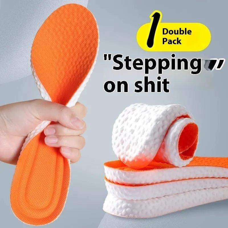A pair of grey high-elasticity PU foam sports insoles on a white background, shown with scissors to illustrate the cut-to-fit design.