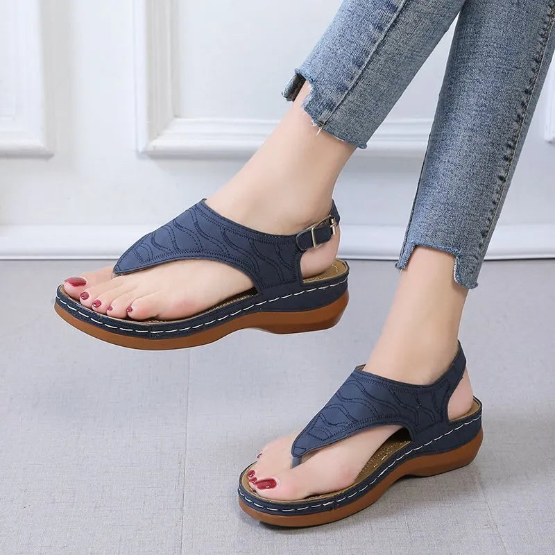 Women's casual wedge heel sandals with adjustable buckle strap in solid red colour