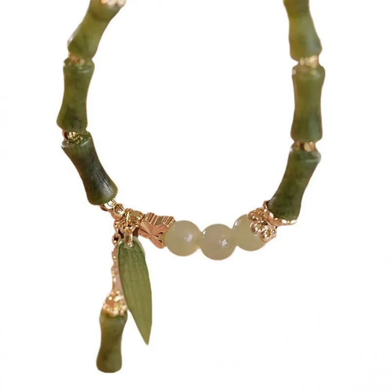 Handmade Chinese style glass women's bracelet featuring bamboo joint design elements.