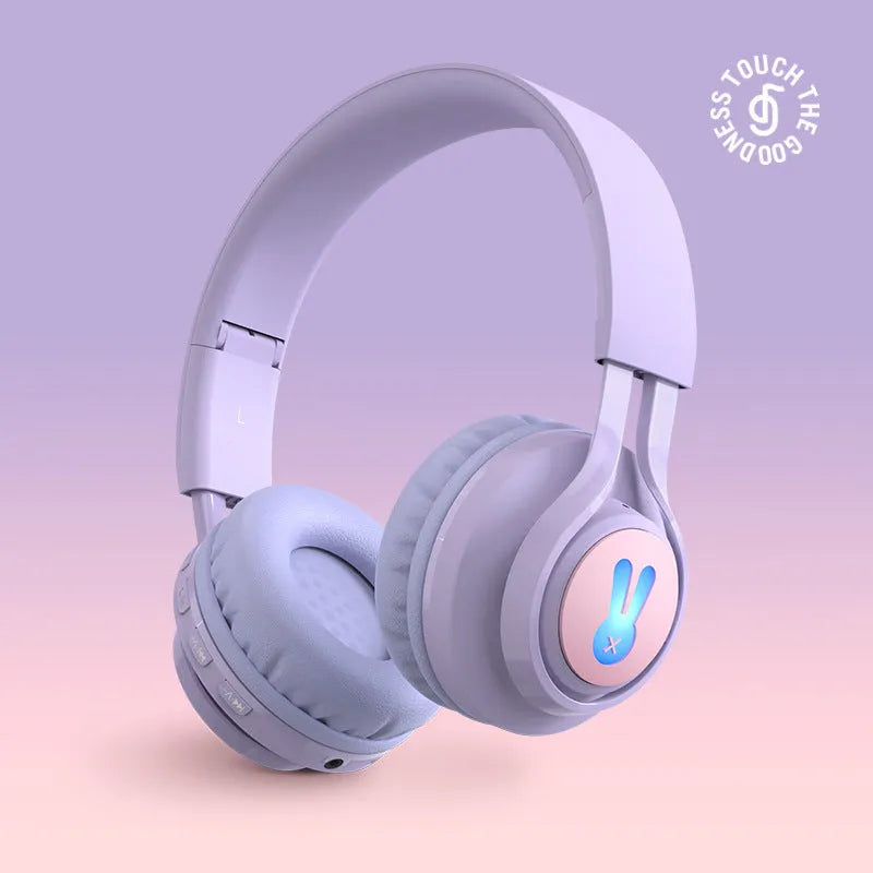 Purple wireless children's headphones with RGB bunny design showing battery display.